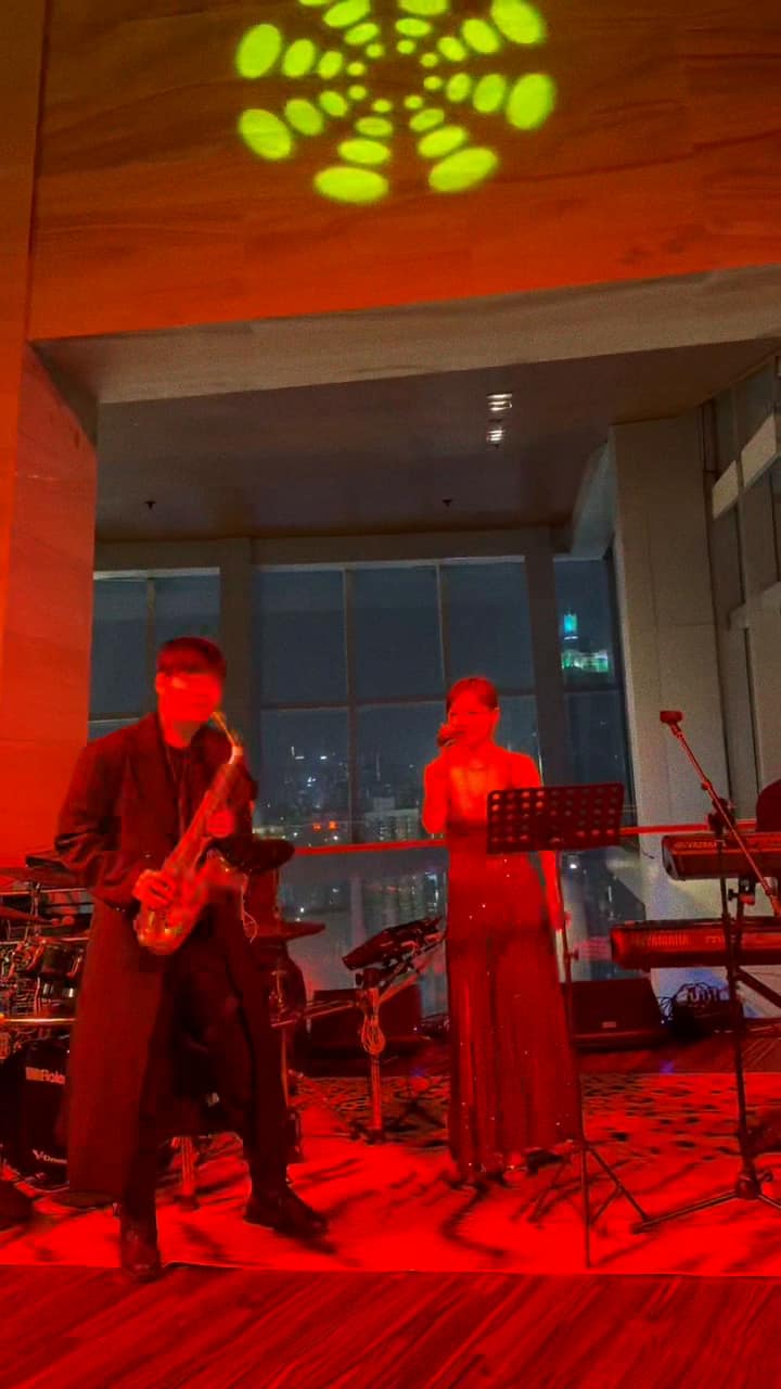 High above the city, with saxophone